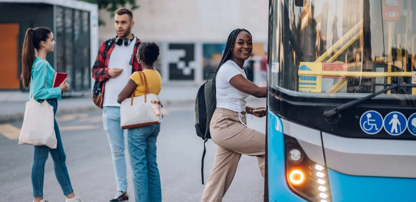 Person getting onto a bus